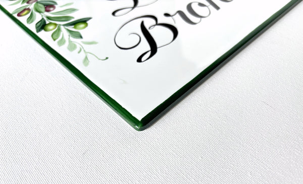 edge detail of a ceramic tile hand-painted in green color