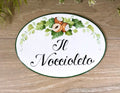 Rustic ceramic door plaque with hand-painted hazelnuts, perfect for B&B rooms, vacation rentals, or countryside guest spaces.