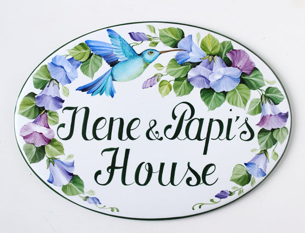 oval ceramic house sign hand-painted with blue hummingbird and flowers