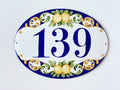 ceramic house number sign hand painted with lemons, green leaves and bue border