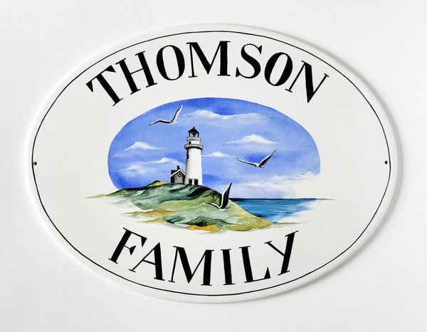 oval ceramic amily name sign hand-painted with lighthouse and seagulls