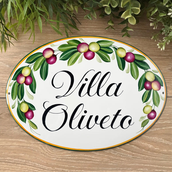 Oval ceramic house sign hand painted with olives and green leaves, personalized with name. 