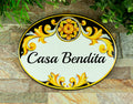 ceramic house sign with family name, hand painted with talavera motives in black and yellow color, outdoor house sign