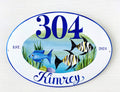 Ceramic house number sign with name hand painted with tropical blue, black and yellow  fishes, coastal wall decor