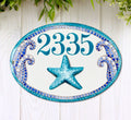 ceramic address sign hand painted with a starfish in teal color and mosaic waves, coastal beach decor