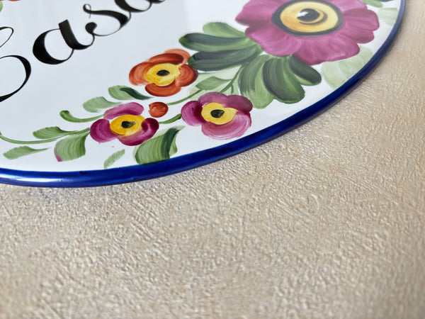 border detail of a hand-painted  ceramic plaque