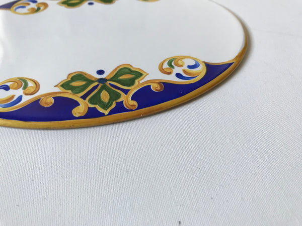 edge of a ceramic house plaque