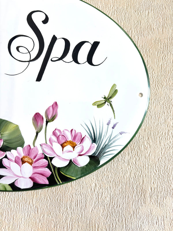 detail decoration of a ceramic house plaque hand-painted with pink lotus