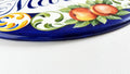 edge detail of a ceramic house plaque and-painted in blue