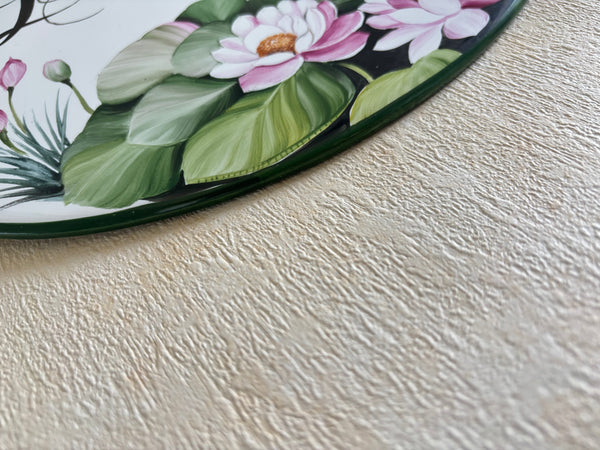 detail of an edge ceramic plaque hand-painted in green