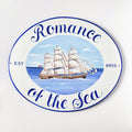 hand painted ceramic house name sign with a ship and text 'Romance of the Sea' on a white background