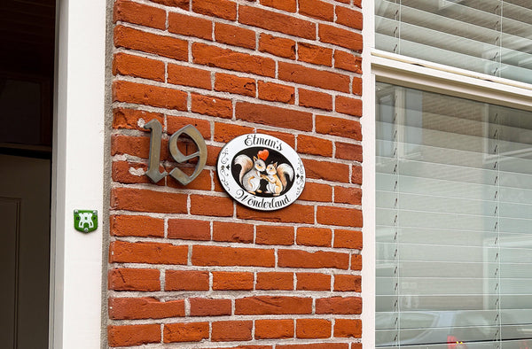 ceramic house plaque hand-painted with two squirrels and a red heart
