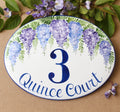 Ceramic oval House number sign hand painted with blue and purple wisteria, blue number and address