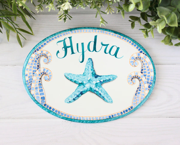 oval door sign with name and starfishceramic house sign with teal starfish 