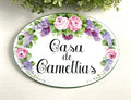 House name sign, oval ceramic plaque with flowers