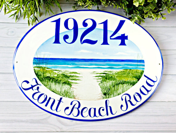 beach house sign with house number and ocean view
