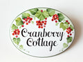 oval ceramic cottage name sign with cranberries