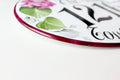 burgundy border detail of a ceramic address plaque