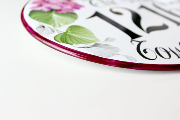 burgundy border detail of a ceramic address plaque