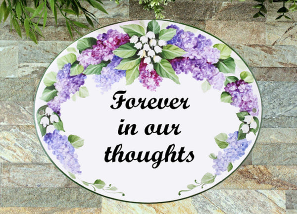 in loving memory sign with lilacs