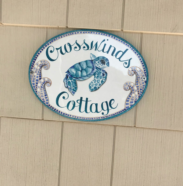 ceramic house name sign, oval shaped hand-painted with teal sea turtle framed with blue mosaic accents